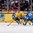 HELSINKI, FINLAND - JANUARY 4: Sweden's Jakob Forsbacka Karlsson #12 reaches for the puck while trying to fend off Finland's Sami Niku #2 and Kasperi Kapanen #24 during semifinal round action at the 2016 IIHF World Junior Championship. (Photo by Andre Ringuette/HHOF-IIHF Images)

